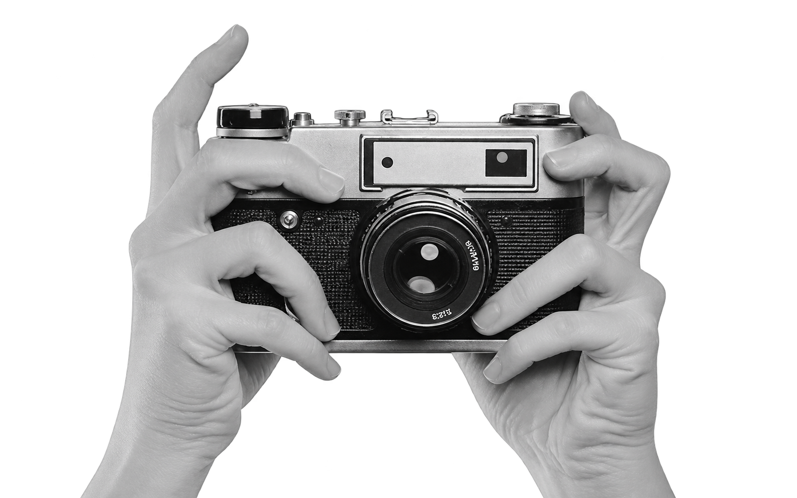 Black and white camera held in two hands